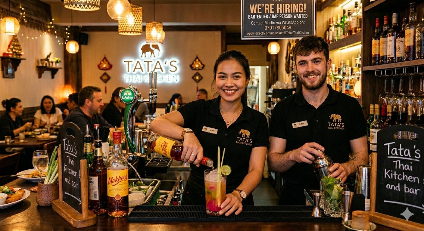 The bar team at Tata's shaking a cocktail